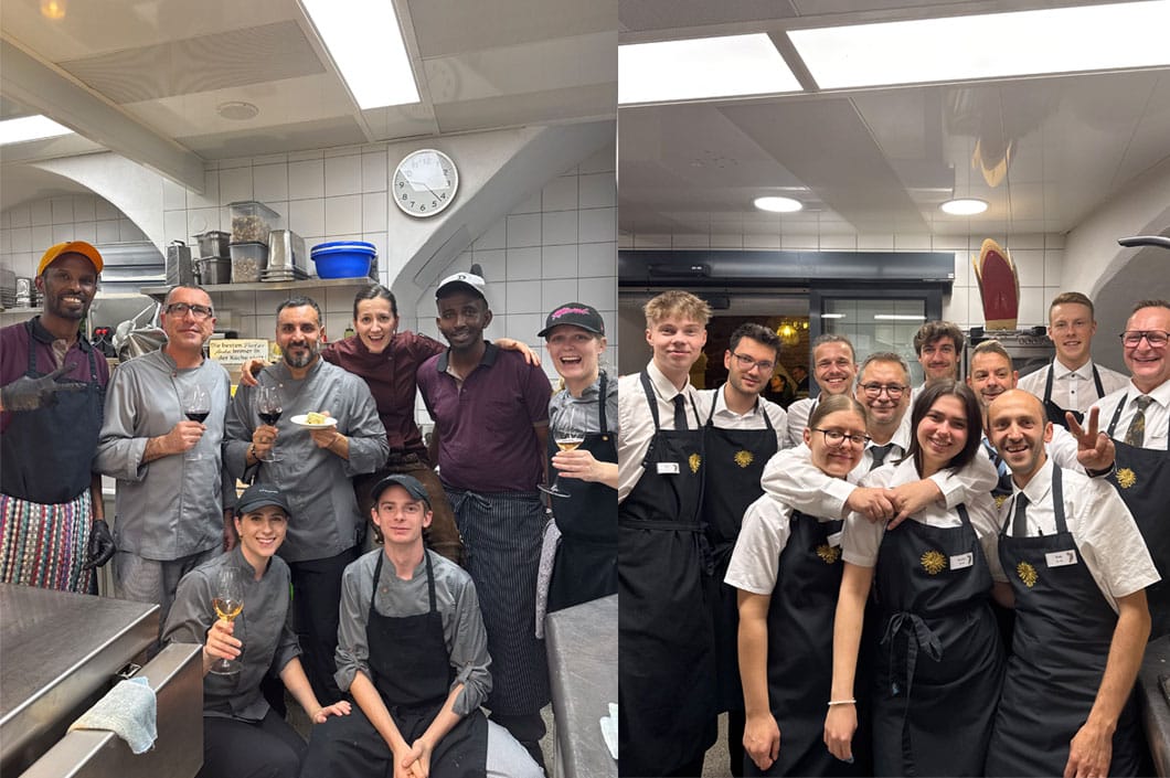 Team photo of the staff and apprentices at Goldener Adler Innsbruck in the kitchen and service, consisting of experienced professionals and young trainees from various nations